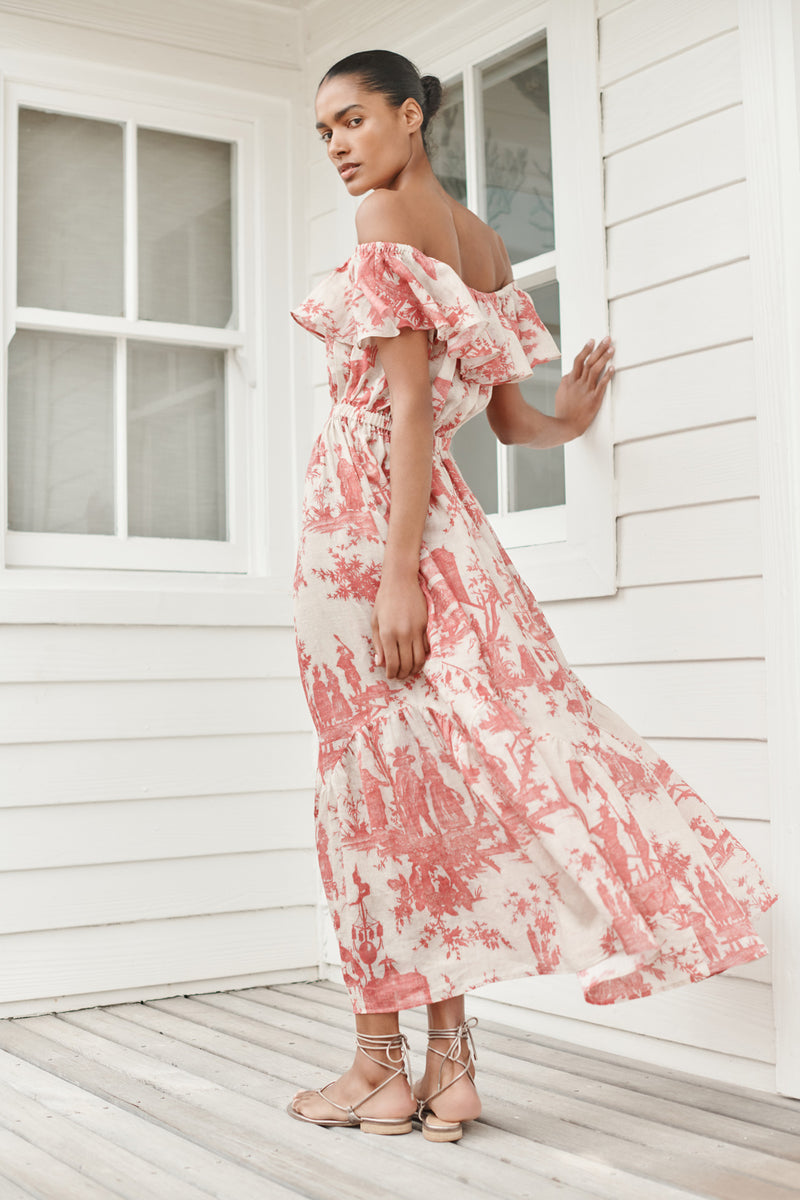 Wiggy Kit | The Gabriella Dress | Model wearing off shoulder maxi dress in red print