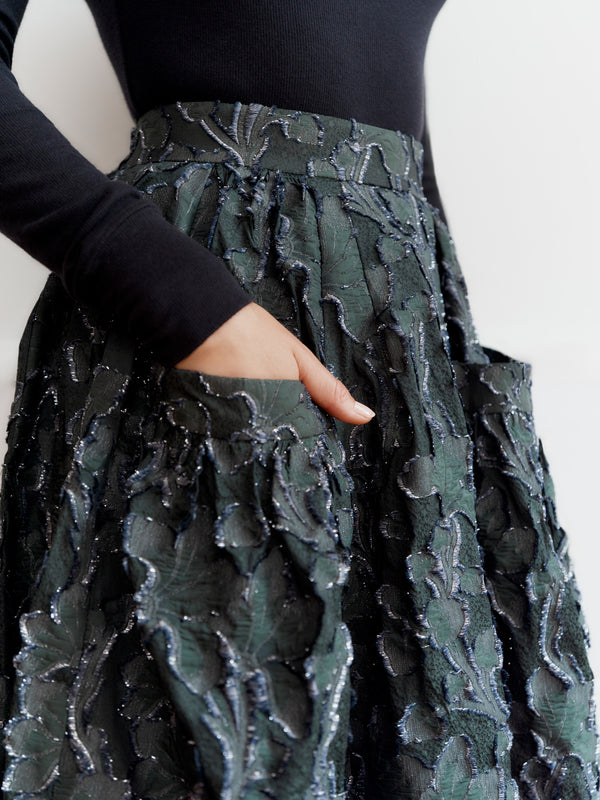 Wiggy Kit model wearing the Gaucho Skirt (Clipped Jacquard) with hand in pocket.